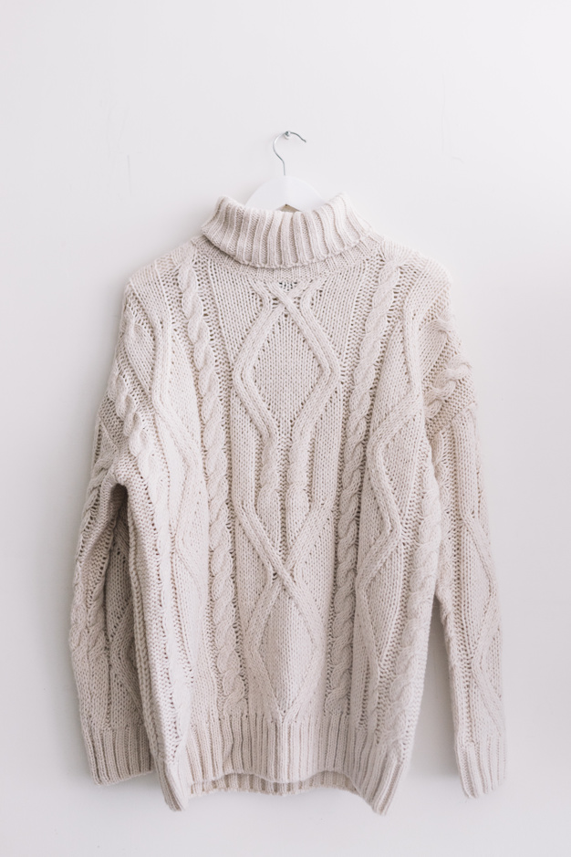 sweater-on-clothes-hunger_23-2147955955